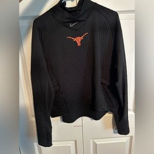 University of Texas team issued slightly cropped, long sleeve top.
